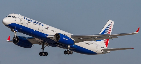 На фото, сделанном 10 лет назад Юрием Степановым: Ту-214 (RA-64509) в бытность его полетов в авиакомпании &laquo;Трансаэро&raquo; уходит в очередной рейс. Домодедово, 26 июля 2014 года